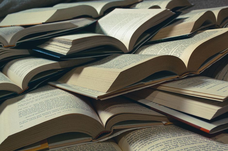 Close-up of hymn books on a shelf with selective focus highlighting the textures.
